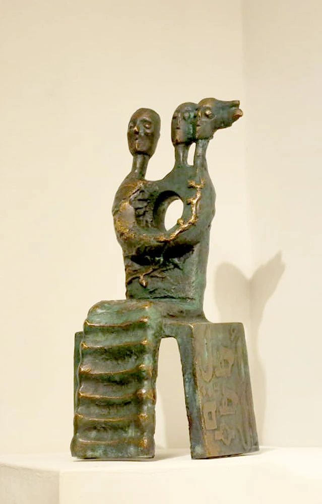 A seated form with multiple heads and steps on one side of the seat.