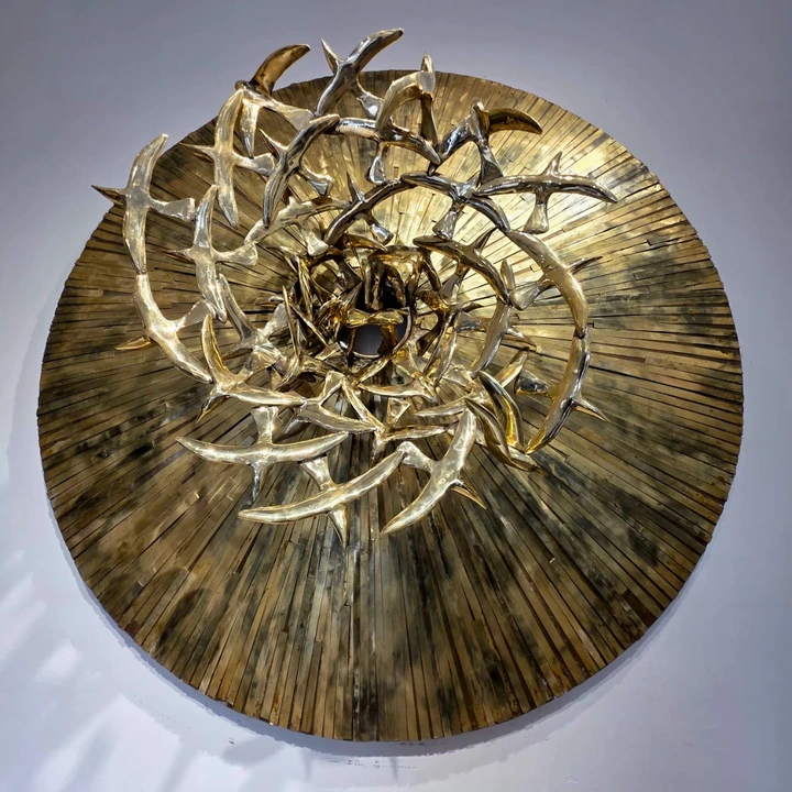The circular wall relief and its birds, seen from a closer angle.