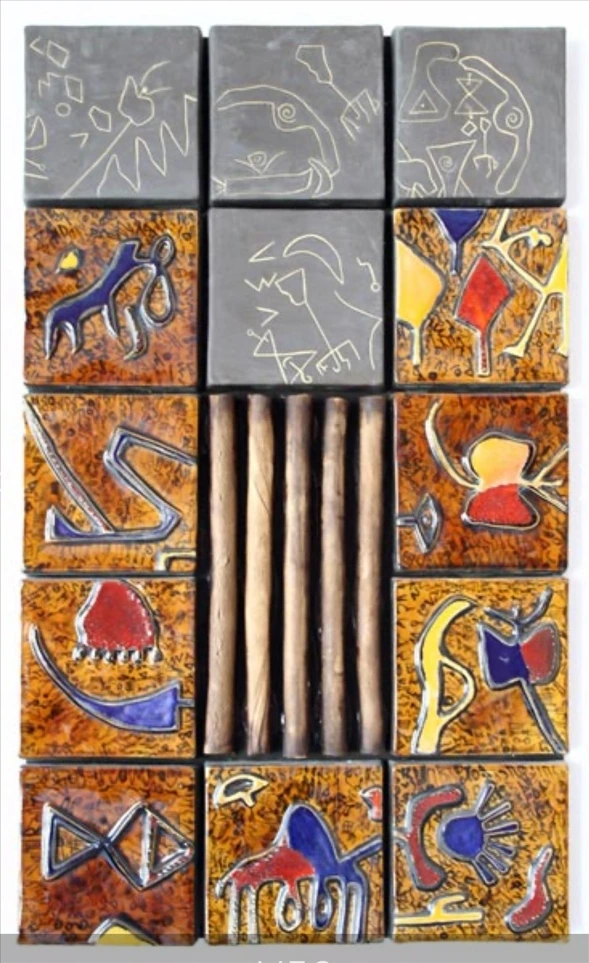 M36 · A vertical panel composition with cylindrical elements at its centre.