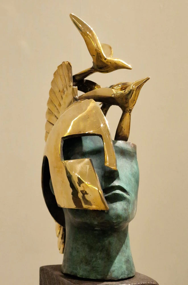 A helmeted head crowned by birds, against a warm-toned background.