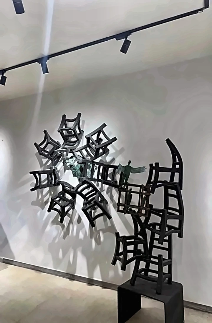 Chairs running from the wall down to the floor in a cascade.