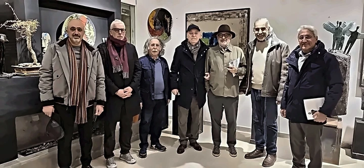 Artists standing together in the hall on the opening night.
