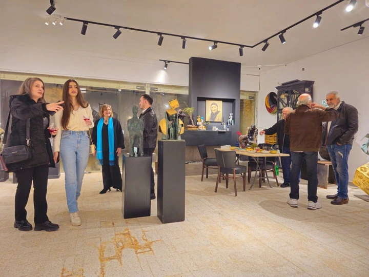Visitors and works in the hall.