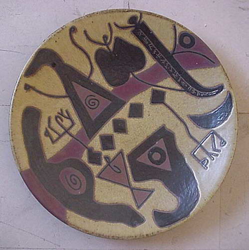 A plate with black hooks and triangles over dusty pink, spirals and small script marks between them.